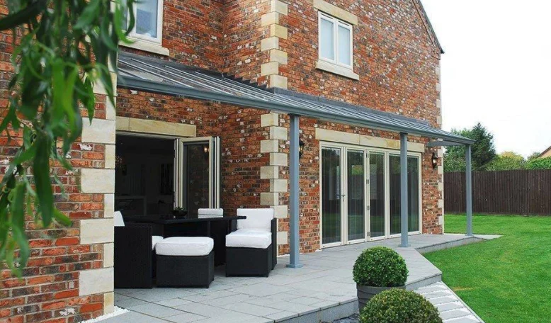 Glazed conservatory adjoining a brick house, from PK Windows’ original gallery